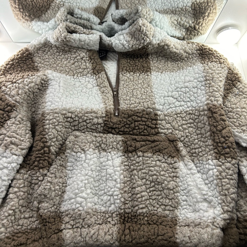 1 Fuzzy soft zip up sweater with pockets. 1 Cropped Brown sweater.